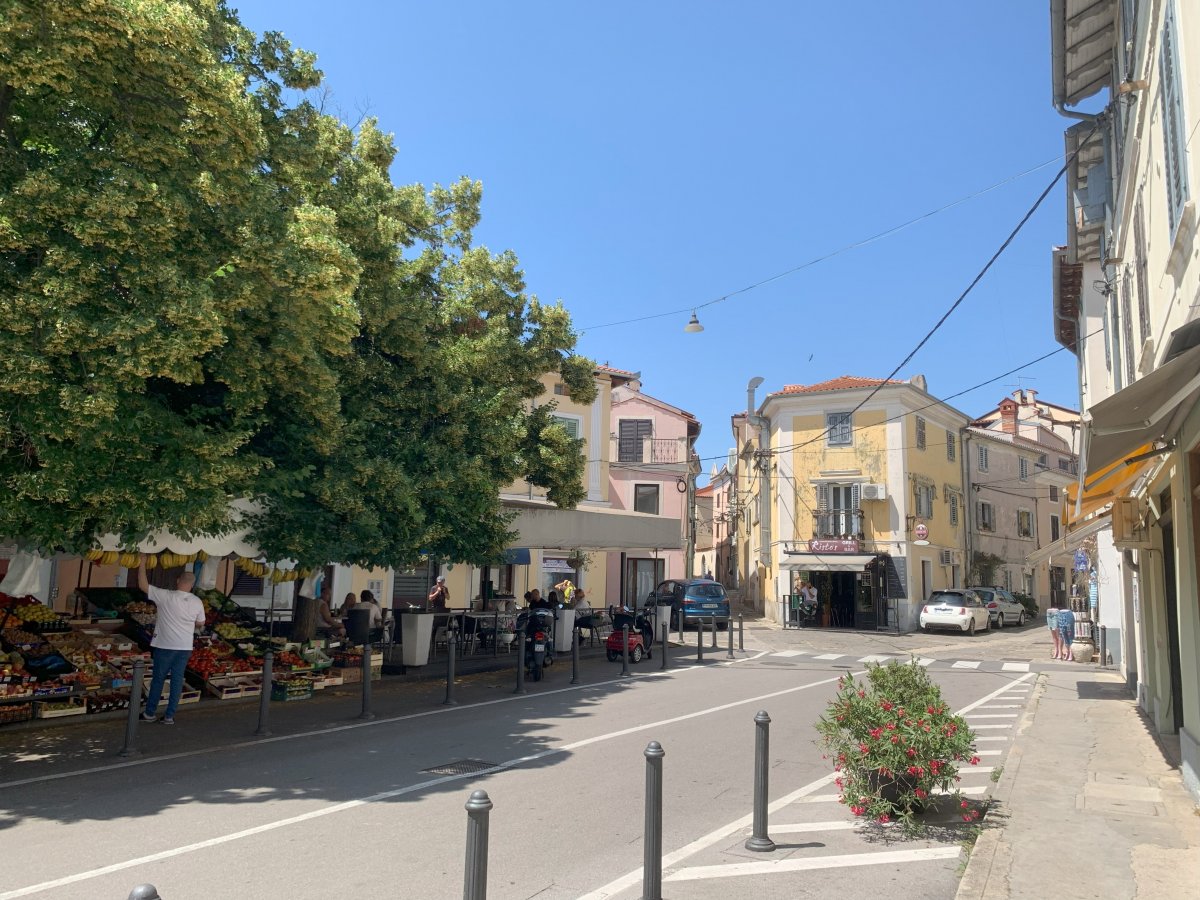 A little street market marks the start of the old town.. A little street market marks the start of the old town..