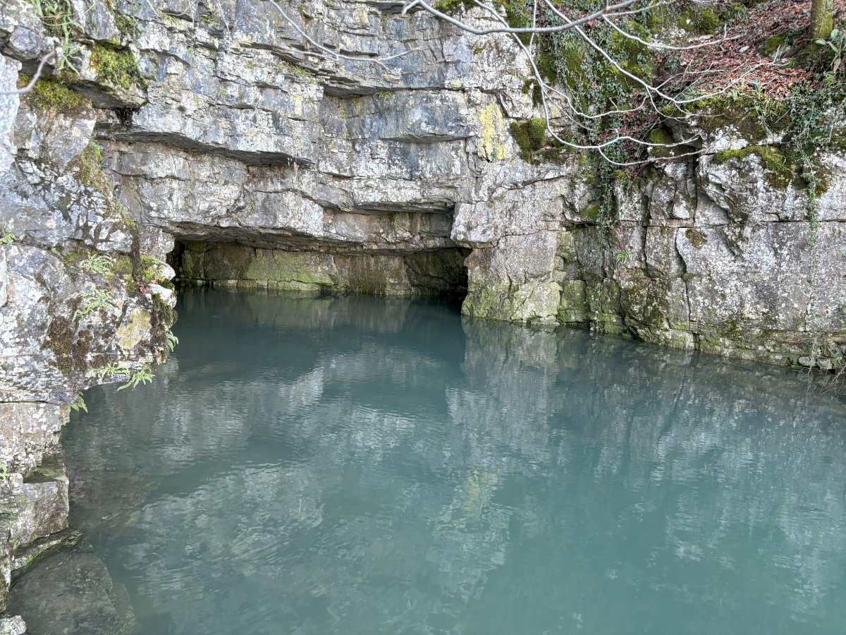 Stand right next to the cave where the water is pumping into the lake..
