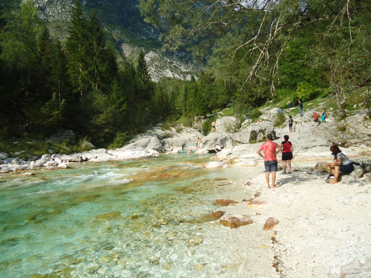 the river exits the Soca gorge and creates a green nature playground with white sand.. the river exits the Soca gorge and creates a green nature playground with white sand..