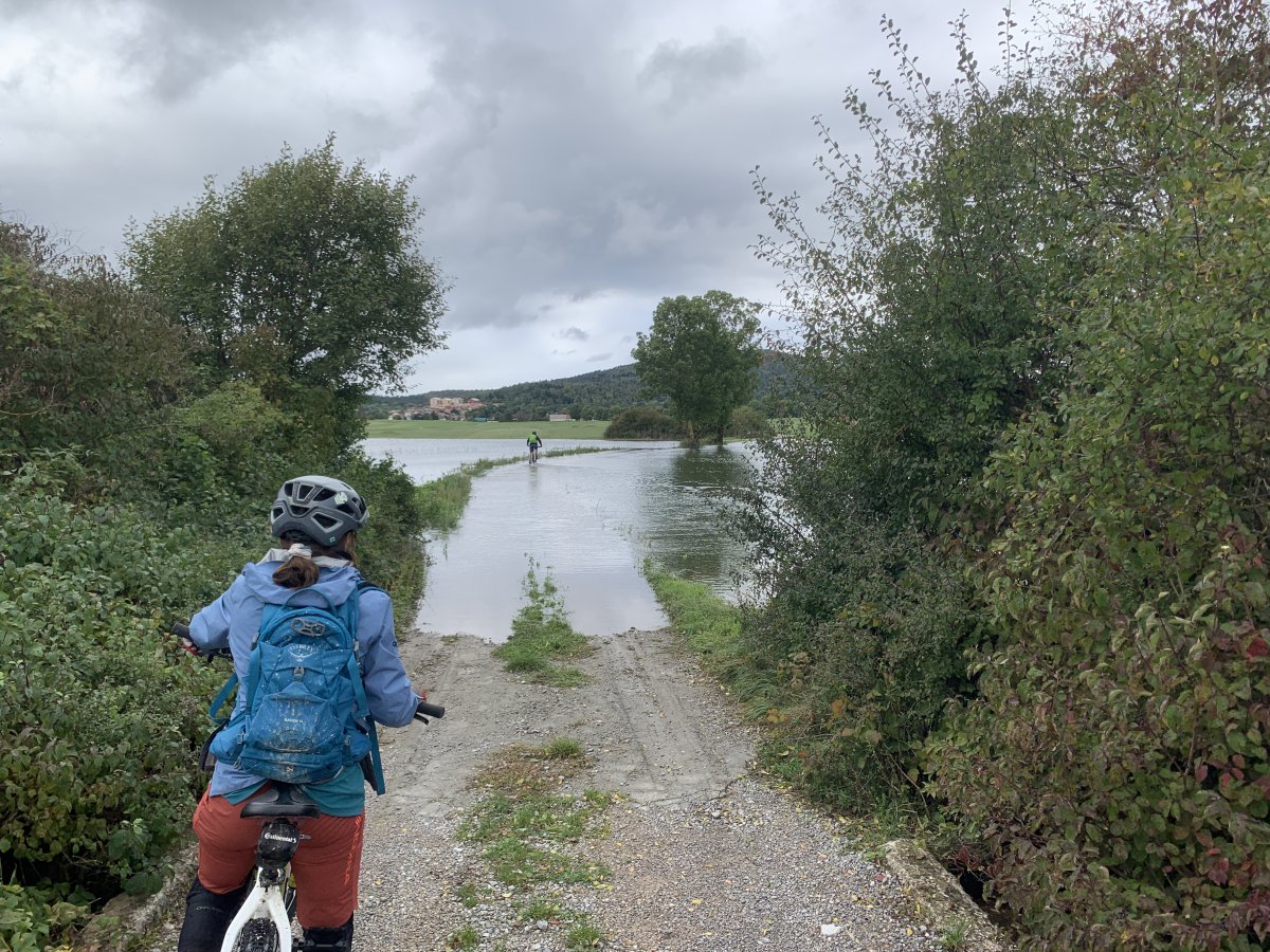 This bridge goes over the Pivka river and some careful cycing required to clear this puddle which disappeared the next day..